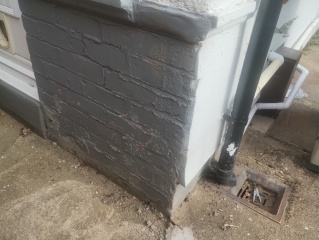Hole in outside kitchen wall by drain, urgent repair or winter patch?