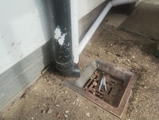 Hole in outside kitchen wall by drain, urgent repair or winter patch?