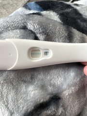 Faint positive at 28 days, negative test later, any experiences?
