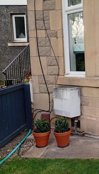 How to hide a gas meter box on outside of house?