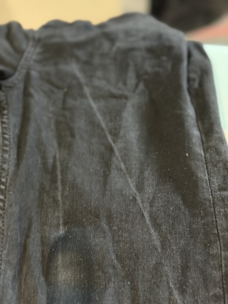 How can I remove white lines from black jeans after washing?