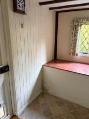 Why would an old utility room have a large concrete slab full of dirt?